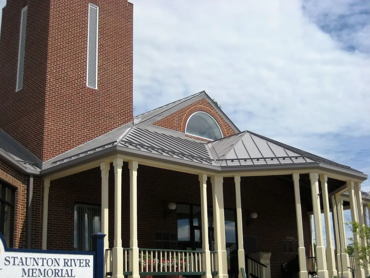 Skilled roofing craftsmen working on a residential roof in Fayetteville